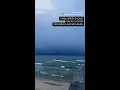 TIMELAPSE Snow system crosses Lake Michigan near Holland