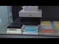 An MCA 96 is pipetting in 96 well format from trough to plate