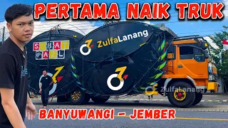 join a truck loading large kites on the way to the kite meetup on jls jember