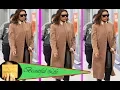 Victoria Beckham looks chic in a camel coat and leather trousers as she jets into New York