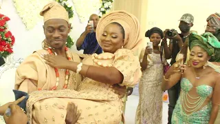 lovely moment lateef adedimeji carrys his wife adebimpe oyebade during their traditional wedding