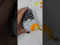 Gnome Painting on Rock