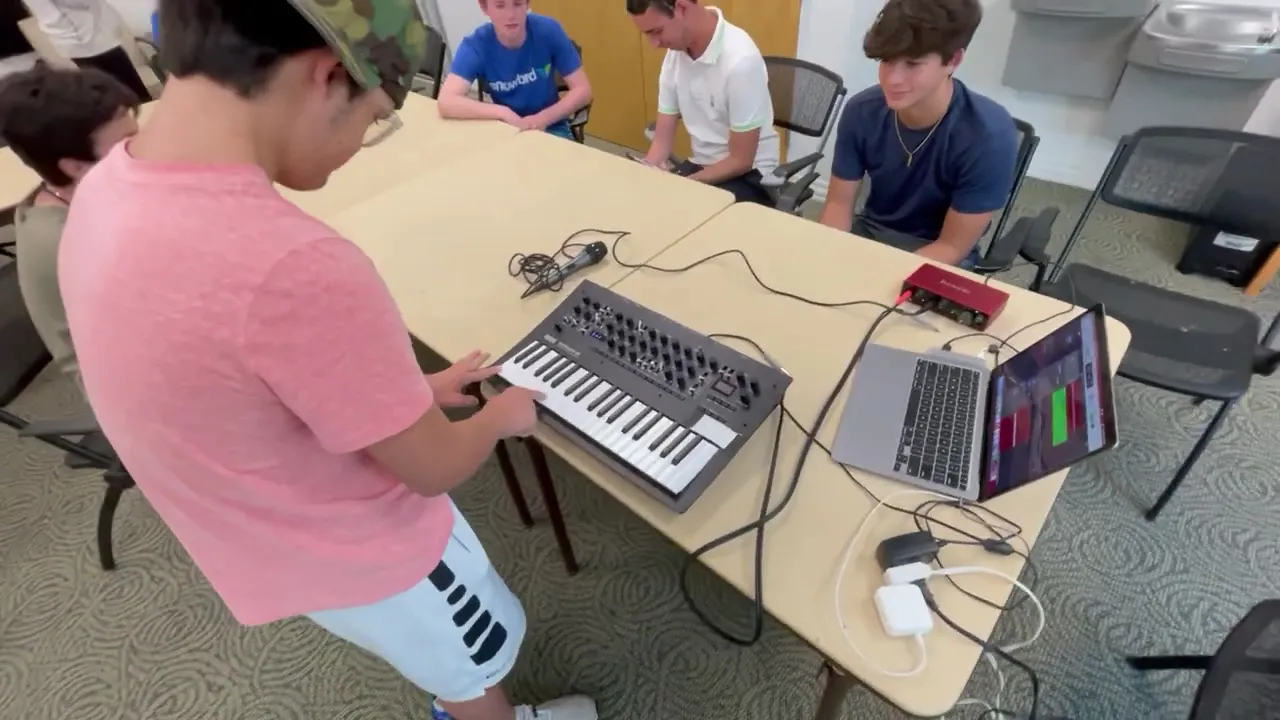 Group music production session at "Social Saturdays" in Key Biscayne