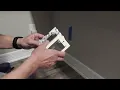 Add a RECESSED outlet from another room with little fishing or holes using Wiremold surface wiring