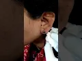 lotus tattoo on a ear lobe