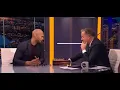 Andrew Tate vs Piers Morgan chess game with digital board