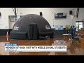 Members of NASA visit with middle school students in Greenville