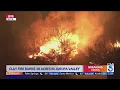 Brush fire ignites in Jurupa Valley threatening structures