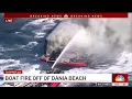 2 people safe after boat consumed by fire in ocean off Dania Beach
