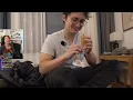 Fuslie watches Michael try the chicken foot