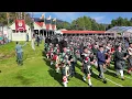 Massed Pipes \u0026 Drums Games field march with Atholl Highlanders at 2024 Braemar Gathering in Scotland