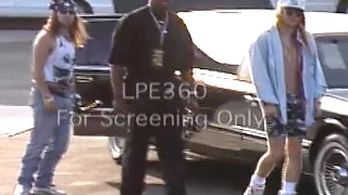 Axl Rose Guns N Roses exiting limo with bodyguards and sword