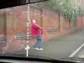 Drunk man tries to walk up the street