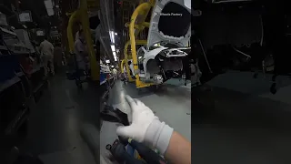 A first-hand perspective of a door assembler at a Chinese car factory