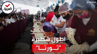 أطول شطيرة  تورتا    طولها    مترا  وزمن إعدادها قياسي دندنها