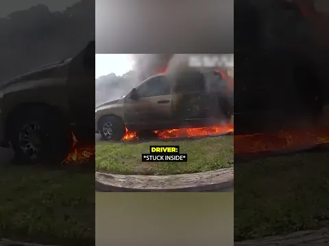 Brave cops save driver from burning car