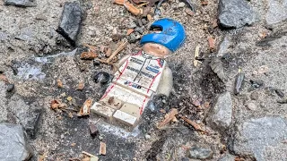 Why are LEGO minifigs hidden in NYC sidewalk?